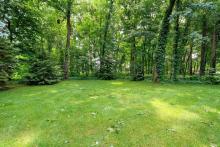 wooded back yard w/ double lot