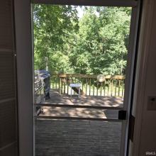 Bedroom 1 French Doors View to Rear Yard