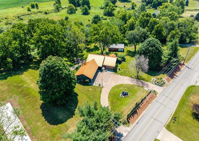 2.32 Acres 3 bedroom 2 1/2 bath home with pole building and fenced area for animals